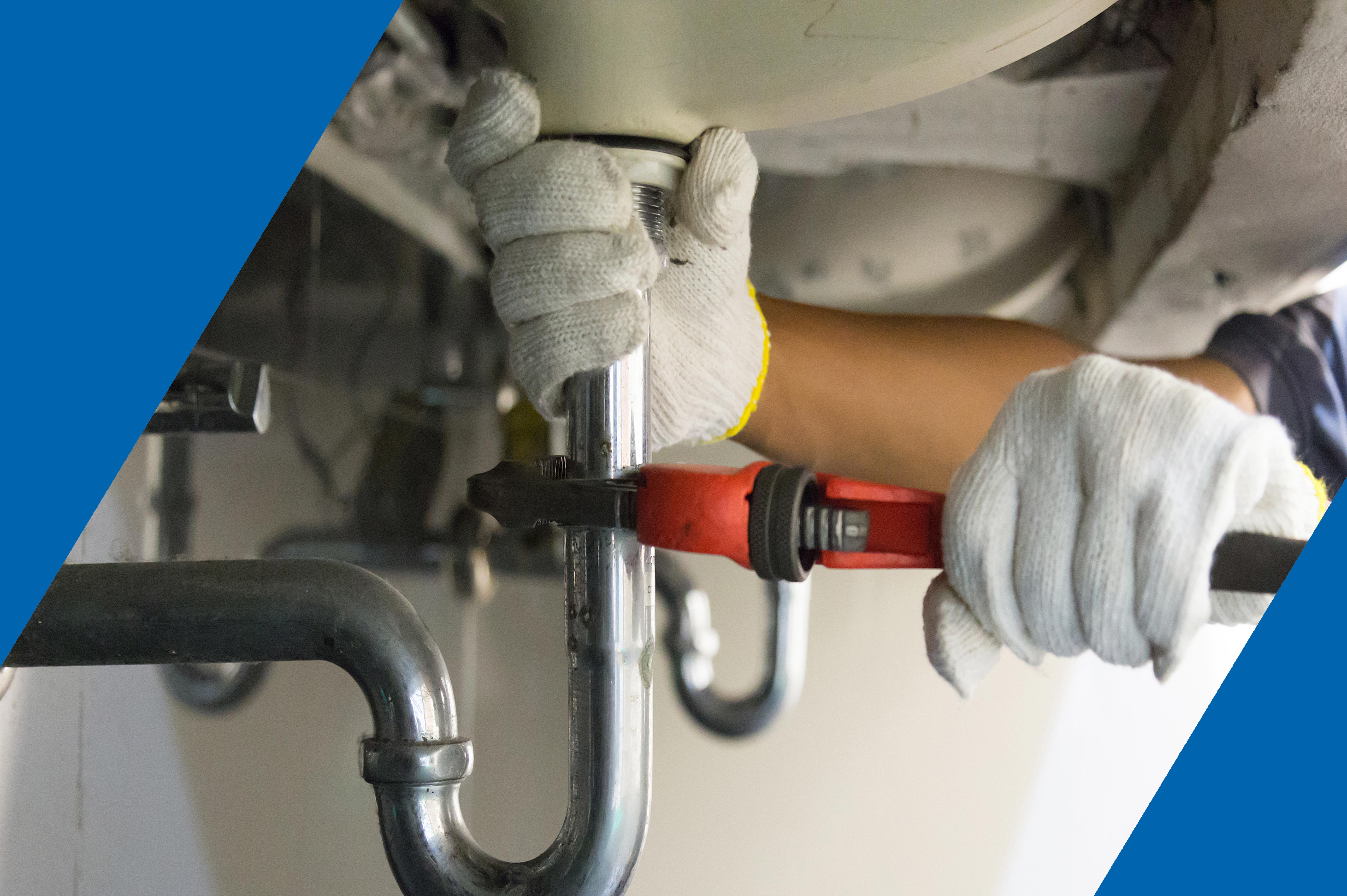 Technician checking plumbing system
