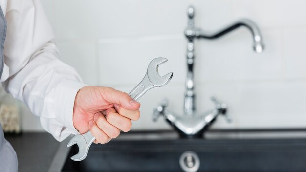 Plumber repairing a kitchen sink